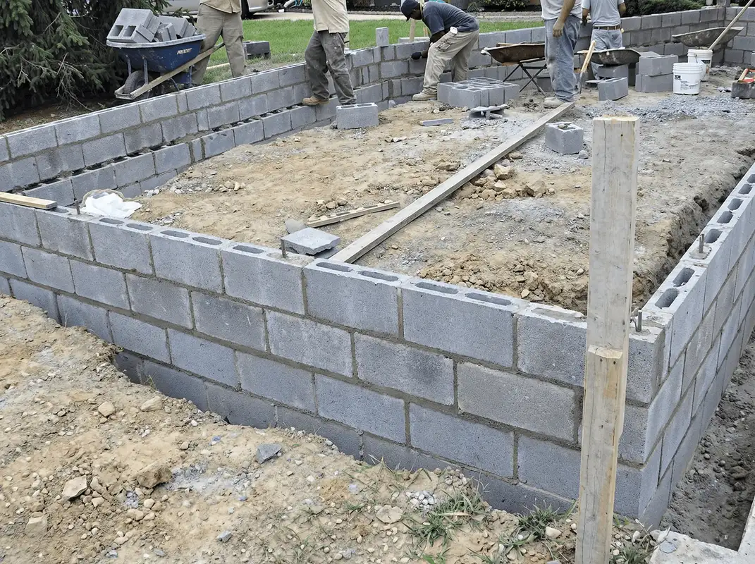 Professionals building a foundation with blocks in Wichita, KS