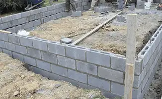 Professionals building a foundation with blocks in Wichita, KS